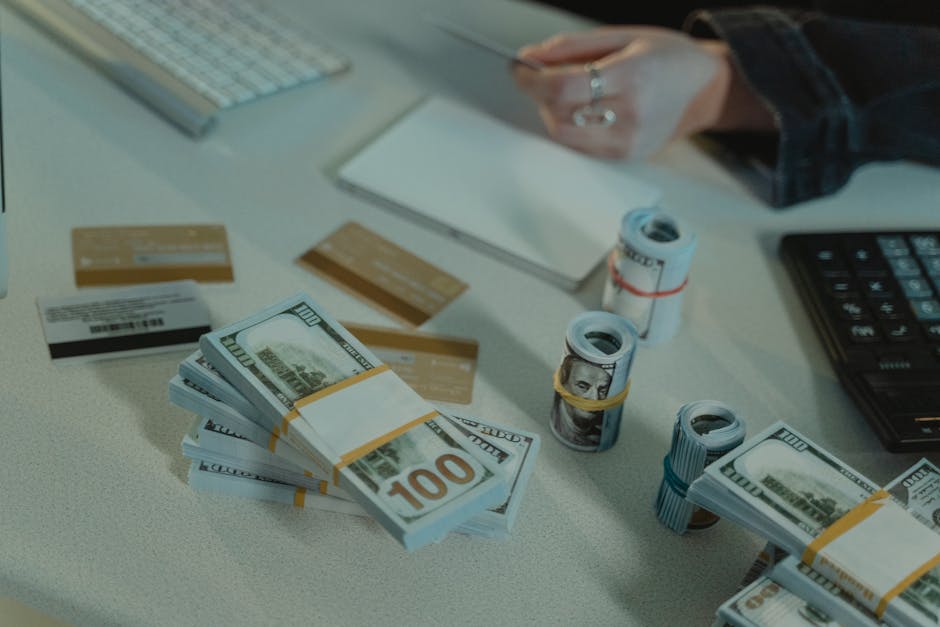 Close-up of dollar bills and credit cards on a desk, symbolizing financial transactions